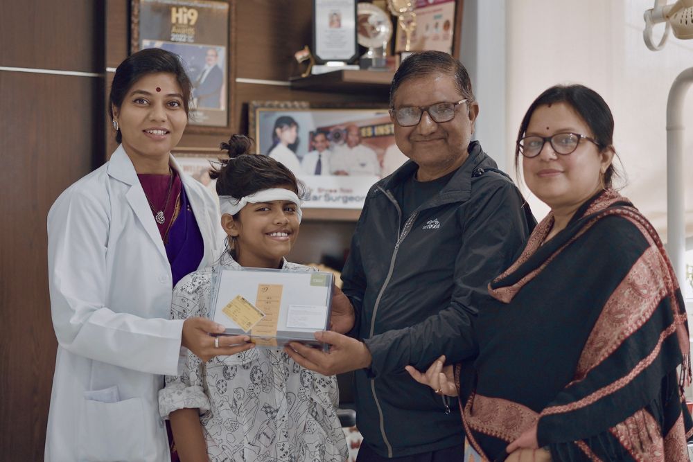 Cochlear Implant Specialist in Hyderabad - Image of Dr Shree Rao with Patient family - Spreading Smiles